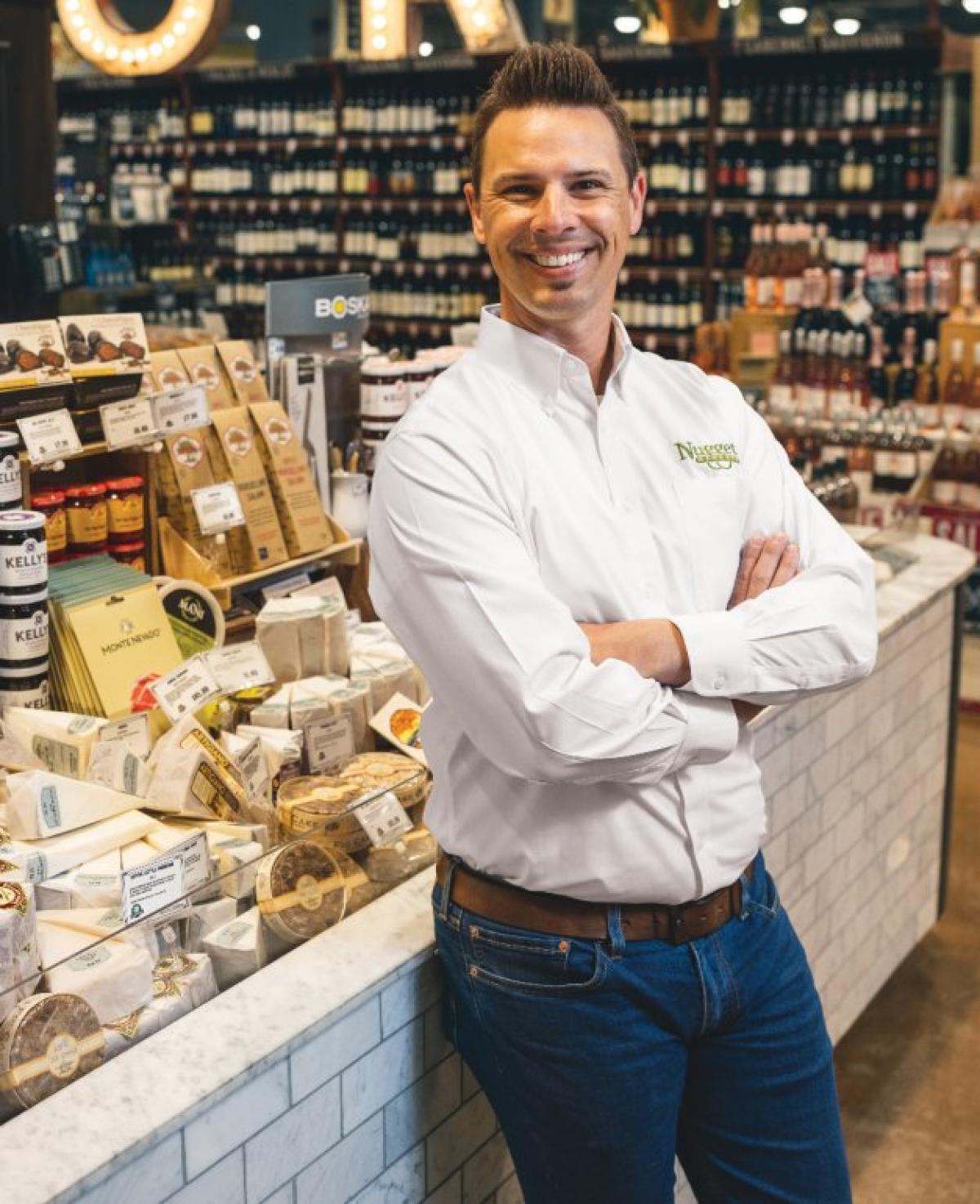Jeremy Patin standing at cheese counter