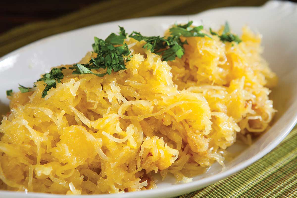 spaghetti squash garnished with olive oil and parsley